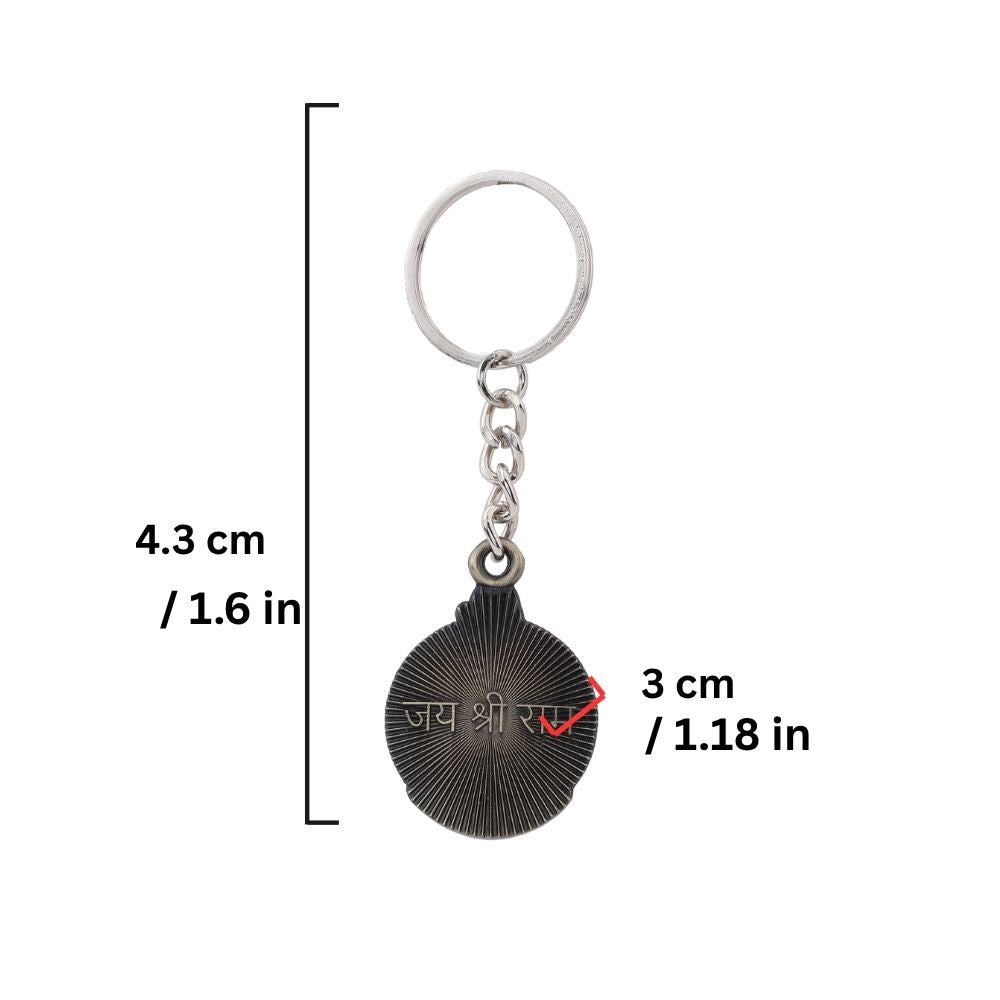 Metal charm keychain with religious design